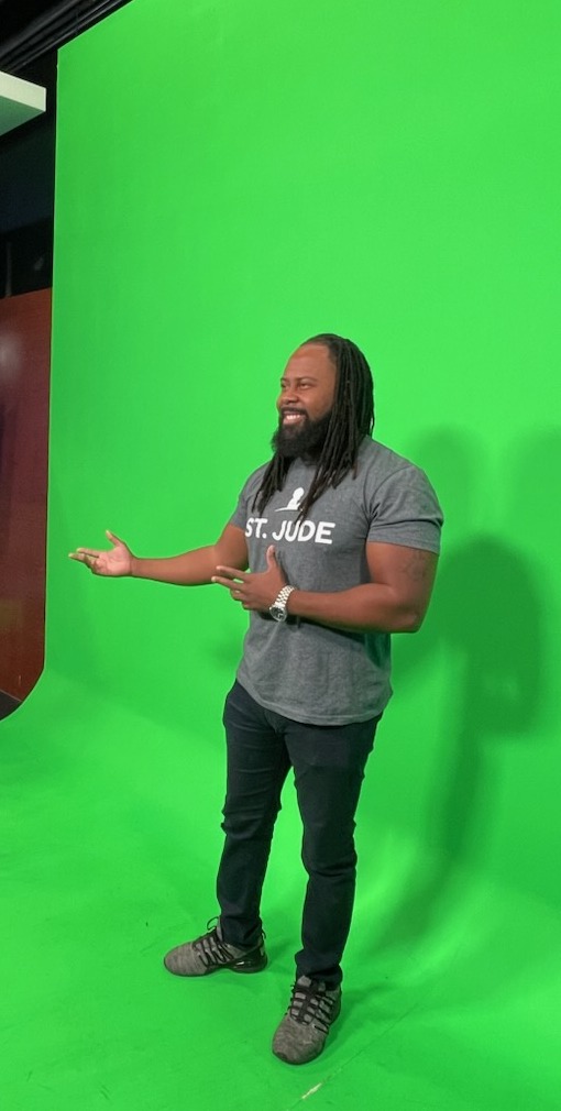 Quentin McCain in a television studio, broadcast ready